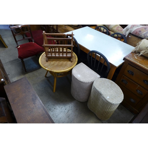 300 - A bamboo occasional table, two cane linen boxes and a magazine rack