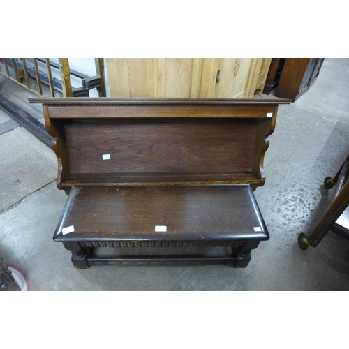 307 - An oak wall shelf and an oak stool