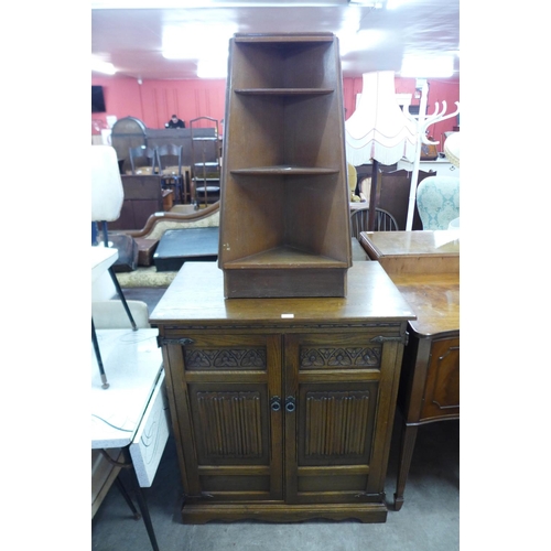 322 - An Old Charm oak TV cabinet and a corner bookcase