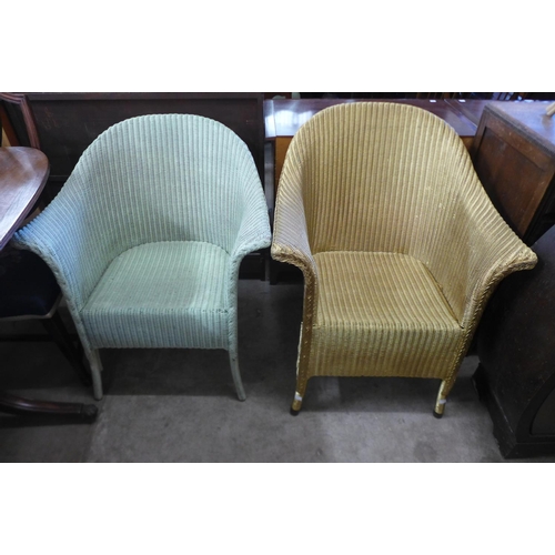 325a - Two painted wicker armchairs