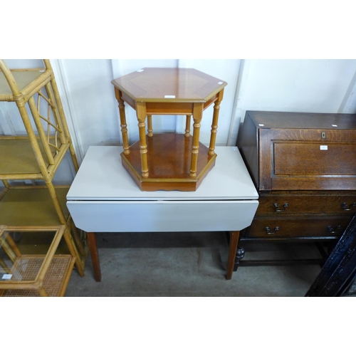 328 - A Formica topped drop-leaf kitchen table and a a teak hexagonal occasional table