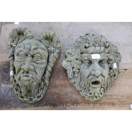 336 - Two concrete wall masks