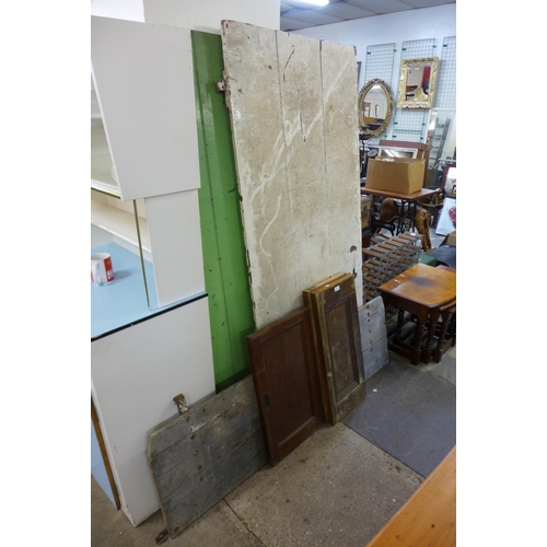 338 - Two painted pine doors, wagon tailgate and three cabinet doors