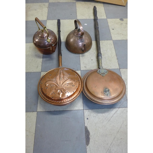 409 - Two copper kettles, a warming pan and chestnut roaster