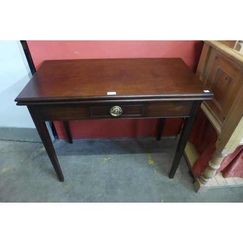 50 - A Victorian mahogany rectangular fold over tea table