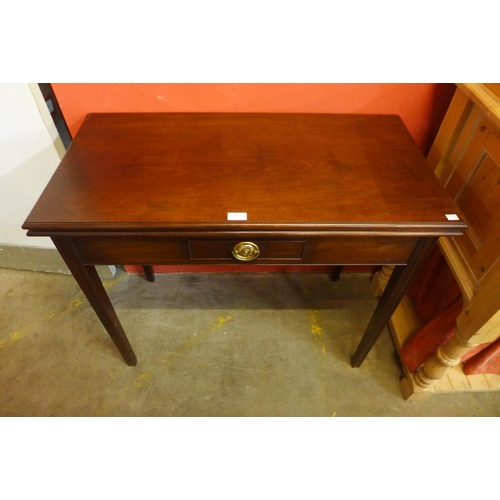 50 - A Victorian mahogany rectangular fold over tea table