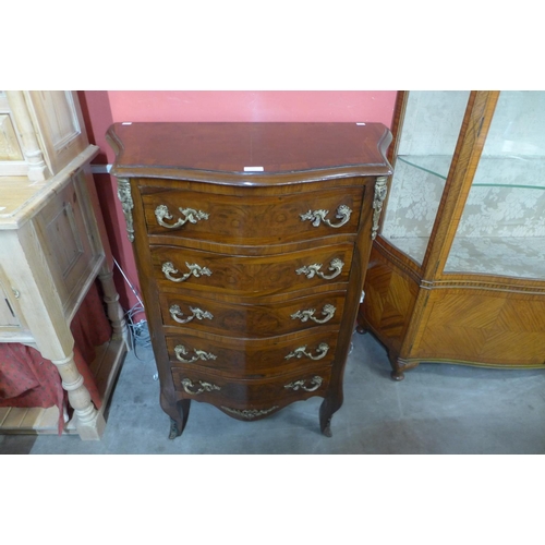 52 - A French Louis XV style walnut and gilt metal mounted serpentine chest of drawers