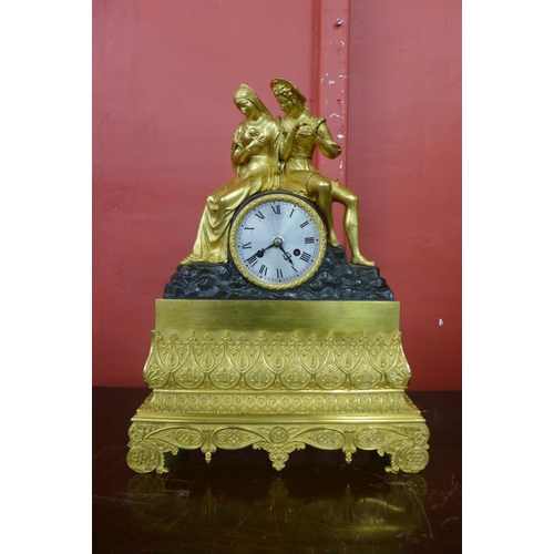 60 - A 19th Century French ormolu and bronze mantel clock, with silk suspension, outside cast wheel and b... 