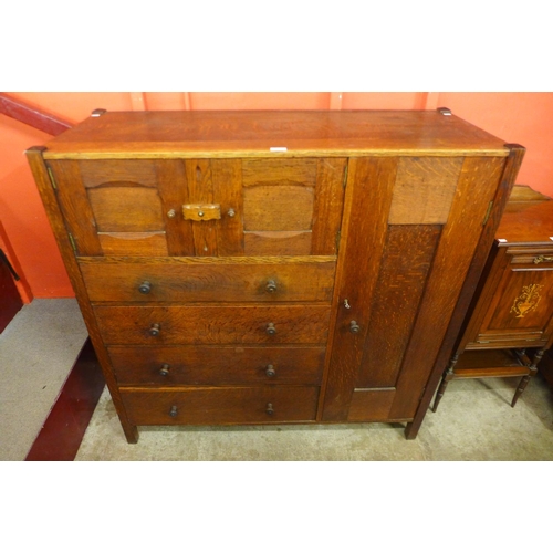 66 - An Arts and Crafts Letchworth oak nursery cupboard, attributed to Ambrose Heal for Heal & Sons, 123c... 