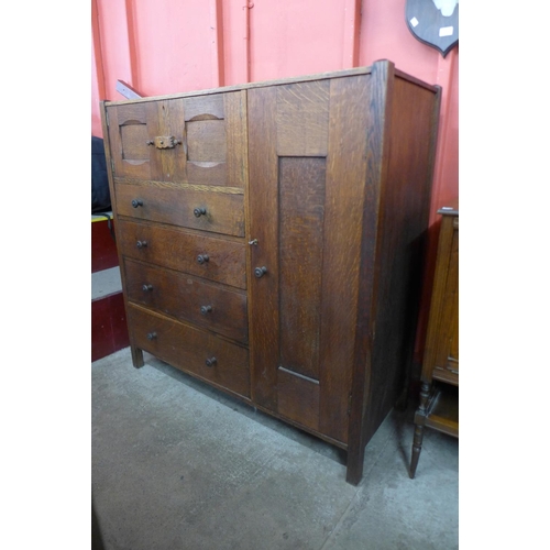 66 - An Arts and Crafts Letchworth oak nursery cupboard, attributed to Ambrose Heal for Heal & Sons, 123c... 