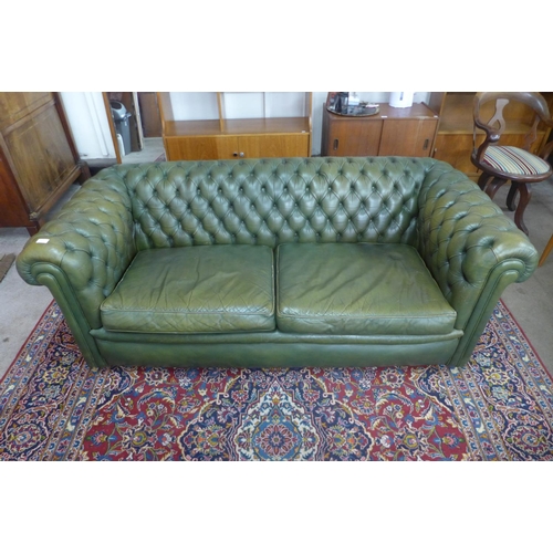 72 - A Chesterfield green leather settee