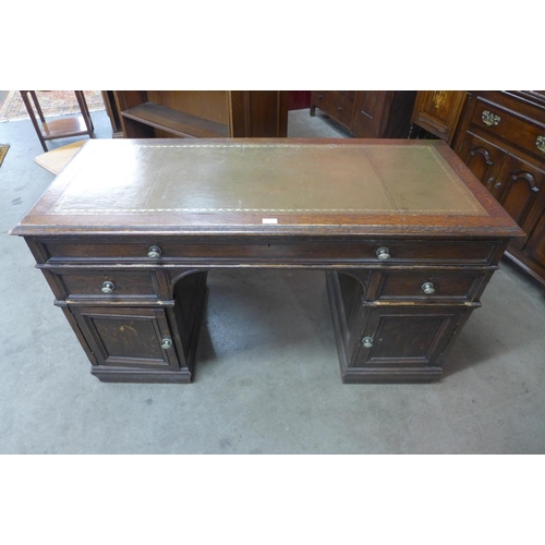 77 - A Victorian oak pedestal desk