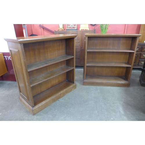 79 - A pair of Edward VII Waring & Gillows oak double sided bookcases, 114cms h, 107cms w, 53cms d