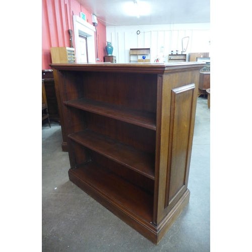 79 - A pair of Edward VII Waring & Gillows oak double sided bookcases, 114cms h, 107cms w, 53cms d