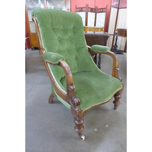 83 - A Victorian mahogany and upholstered open armchair