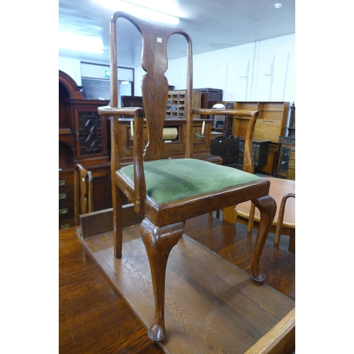 91 - An Edward VII oak extending dining table and eight chairs