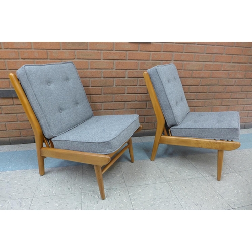 95 - A pair of Scandart teak and Harris Tweed lounge chairs