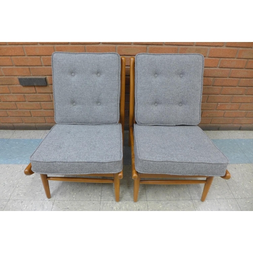 95 - A pair of Scandart teak and Harris Tweed lounge chairs