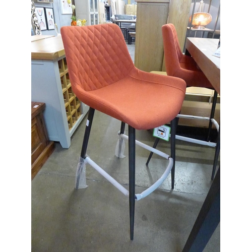 1437 - A set of four red upholstered Sigma bar stools