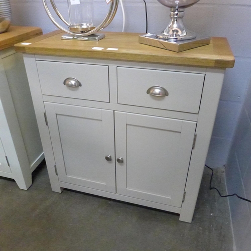 1464 - An oak and truffle two door sideboard