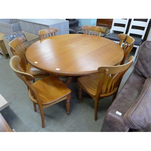 1859 - A pine circular dining table and six chairs