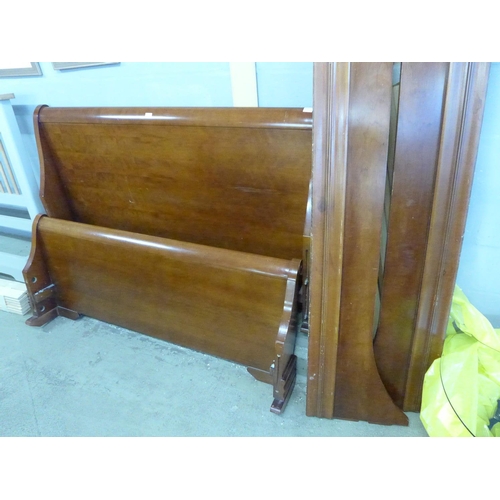 1895 - A reproduction cherrywood sleigh bed - damaged