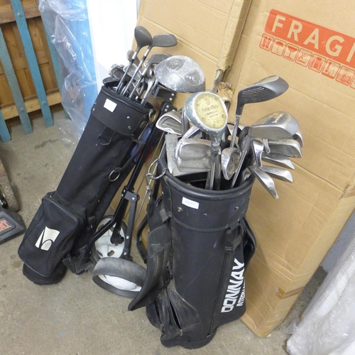 2610 - 2 Golf bags, qty. of irons/woods (Ram, Wilson, Regal, Wild Thing) etc., with golf trolley