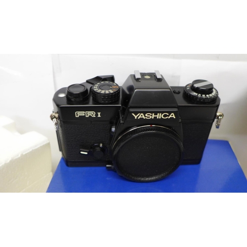 711 - A Yashica FRI SLR camera body, a Yashica 50mm f1.7 standard lens and a Sunpak Gx28 electronic flash ... 