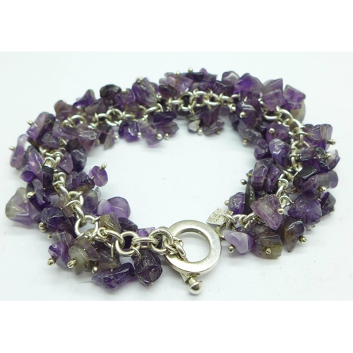 1003 - A silver mounted amethyst quartz bracelet, in a Kit Heath box