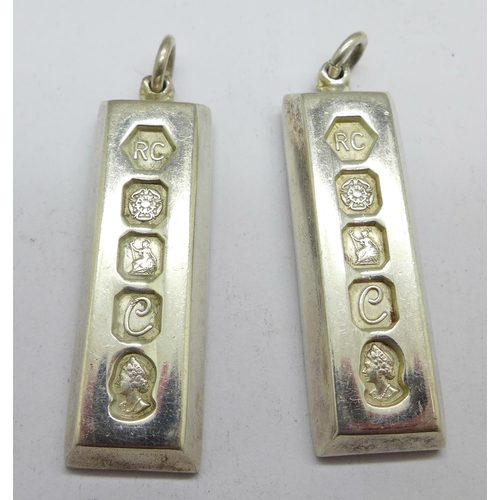 1004 - Two silver ingot pendants, 61.2g