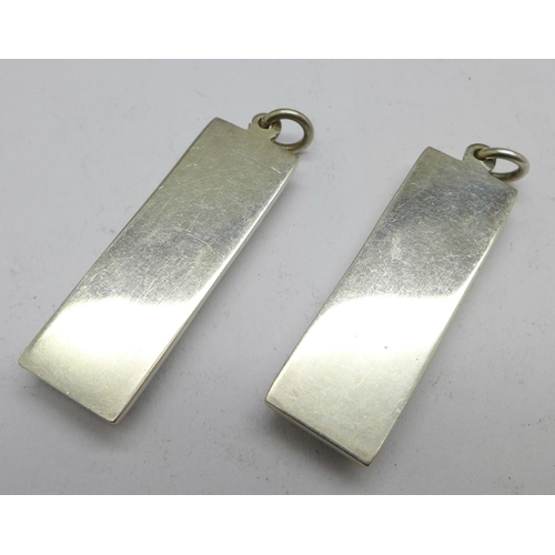 1004 - Two silver ingot pendants, 61.2g