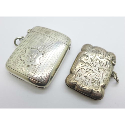 1122 - Two silver vesta cases, one with monogram, 60g