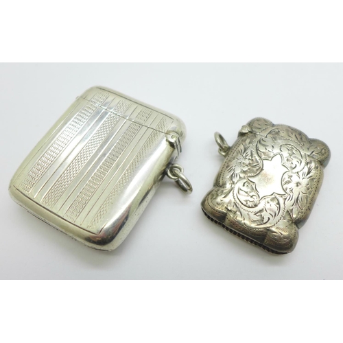 1122 - Two silver vesta cases, one with monogram, 60g