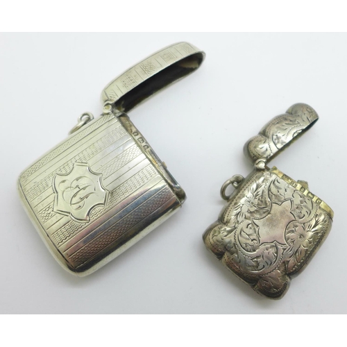 1122 - Two silver vesta cases, one with monogram, 60g