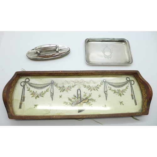 1127 - A small silver tray, Birmingham 1922, 49g, a silver nail buff, Birmingham 1911 and an embroidered si... 