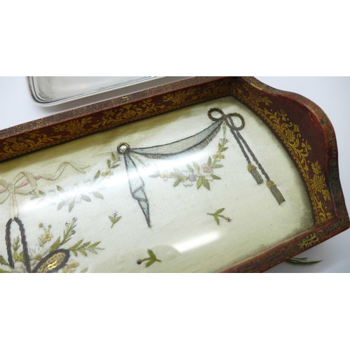 1127 - A small silver tray, Birmingham 1922, 49g, a silver nail buff, Birmingham 1911 and an embroidered si... 