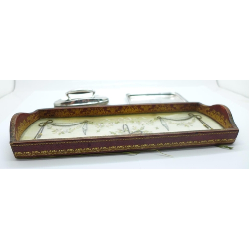 1127 - A small silver tray, Birmingham 1922, 49g, a silver nail buff, Birmingham 1911 and an embroidered si... 