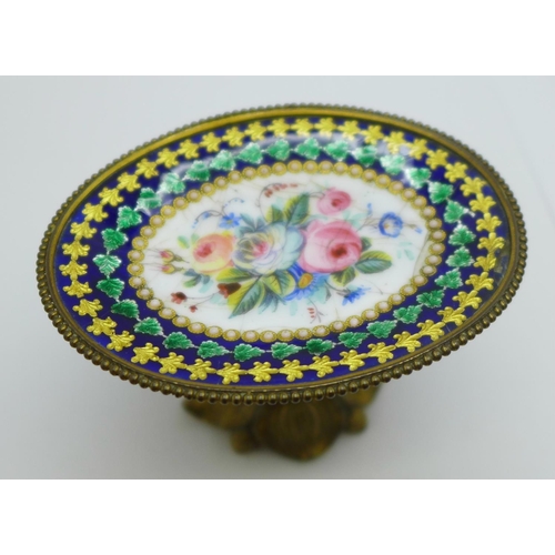 1129 - A miniature oval stand, gilt metal and enamelled with painted flowers, a/f