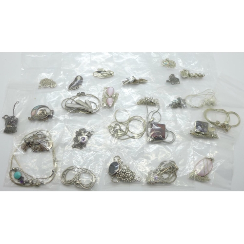 1131 - Twenty-five silver pendants and chains