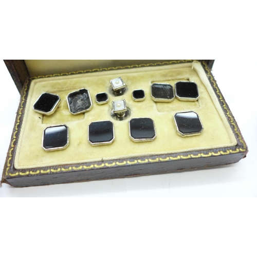 1132 - Four cased stud sets (incomplete), one in silver