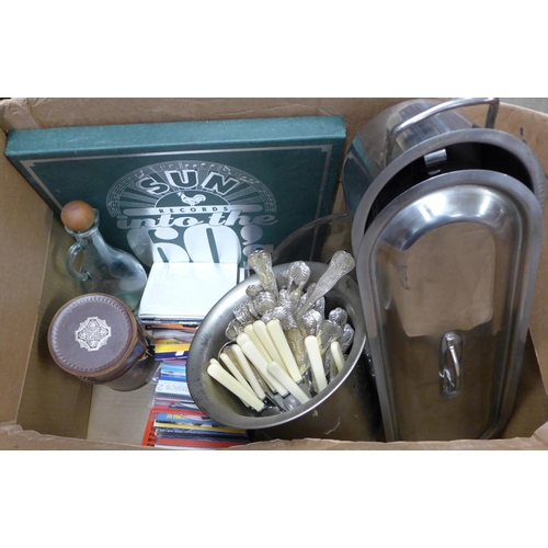 1236 - A box of glassware, stainless steel wine cooler, flatware, records, CDs, etc. **PLEASE NOTE THIS LOT... 