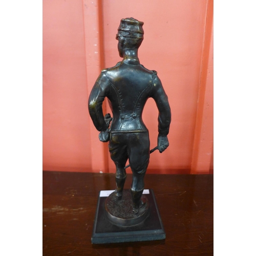 88 - A bronze figure of a French soldier, on black marble socle