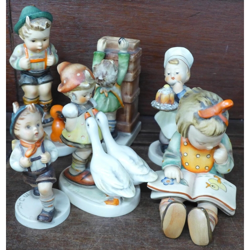 715 - A collection of eight Hummel figures, all a/f