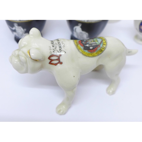 719 - Over forty pieces of crested china, (small chip on bulldog paw)