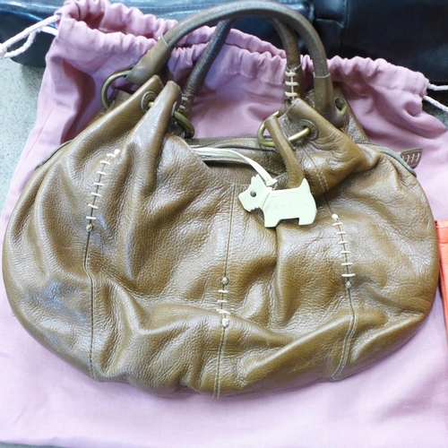 725 - A Radley handbag, four others and a purse