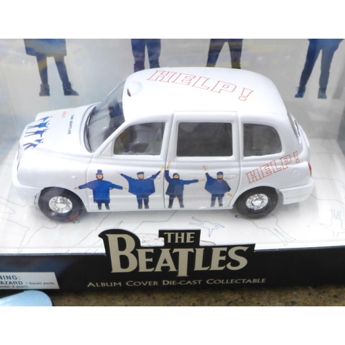 743 - Beatles interest: five boxed Beatles buses, taxis, etc., and an unboxed Corgi Magical Mystery Tour b... 