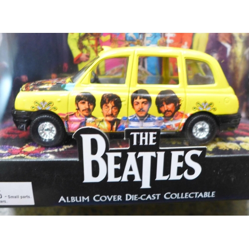 743 - Beatles interest: five boxed Beatles buses, taxis, etc., and an unboxed Corgi Magical Mystery Tour b... 