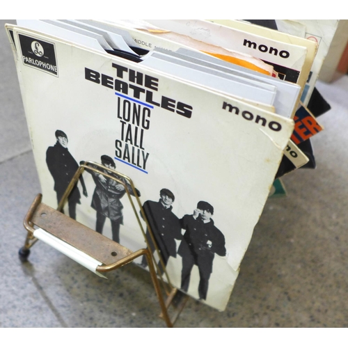 752 - Beatles interest: a 1960's Beatles record rack with a collection of  1960's records including nine B... 