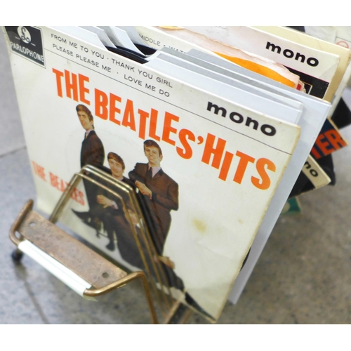 752 - Beatles interest: a 1960's Beatles record rack with a collection of  1960's records including nine B... 