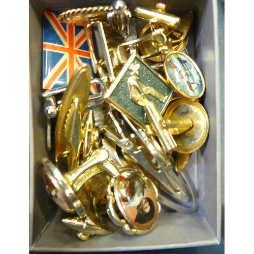 785 - A collection of cufflinks, (one pair silver) tie pins, postcards, a bowling table lighter, medallion... 